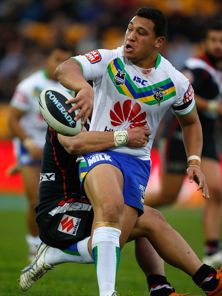 Looking for support ... Josh Papalii offloads the ball against the Warriors