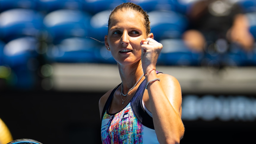 A Czech female player pumps her fist in celebration at the Australian Open.