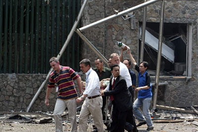 An injured person is evacuated from the Australian embassy in Jakarta