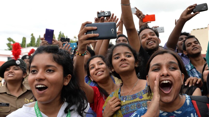 Crowd of gatherers take photos of Bollywood stars