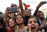 Crowd of gatherers take photos of Bollywood stars