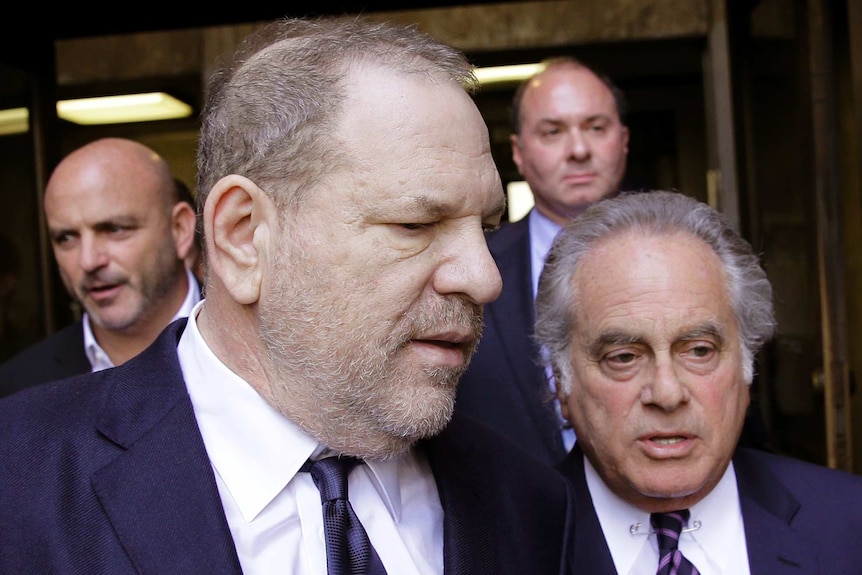 Harvey Weinstein, left, walking next to his attorney Benjamin Brafman.