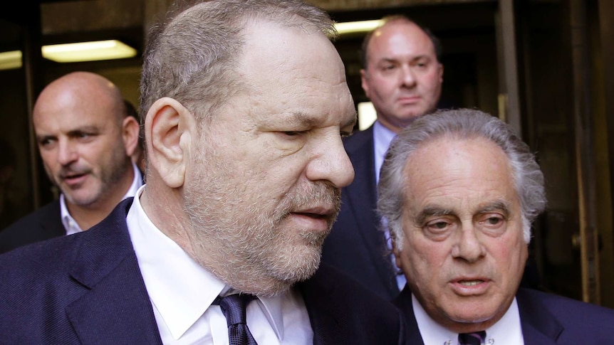 Harvey Weinstein, left, walking next to his attorney Benjamin Brafman.