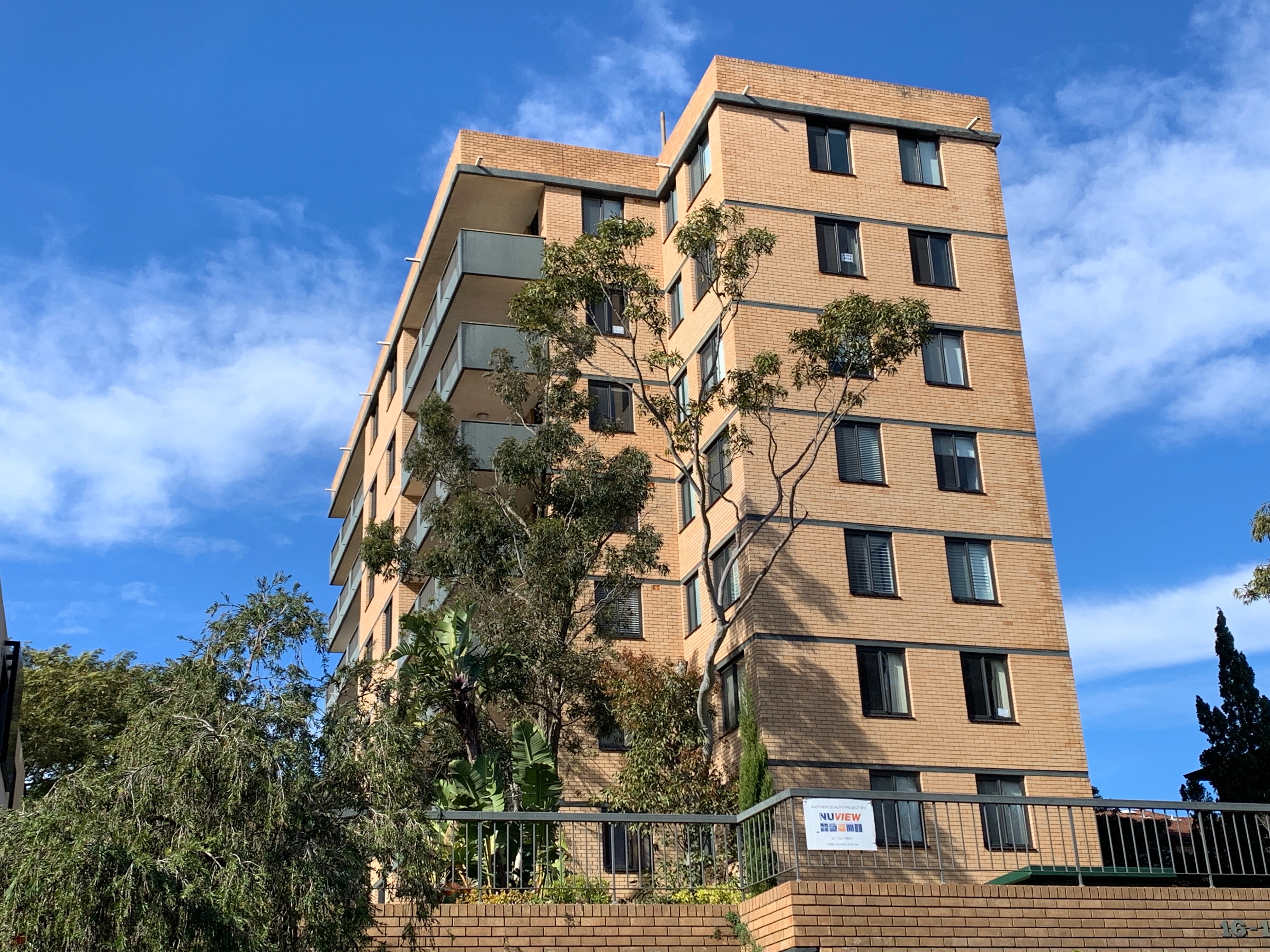 A tall brown apartment building
