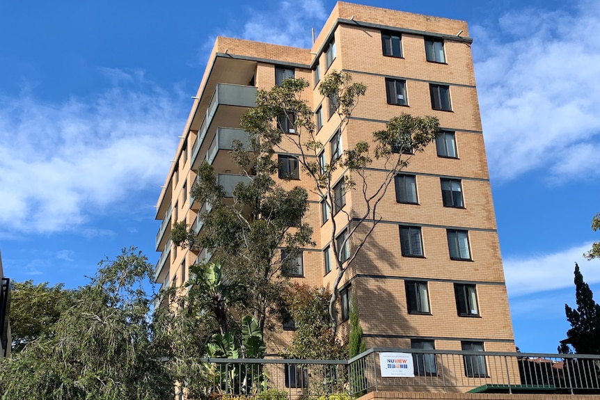 A tall brown apartment building