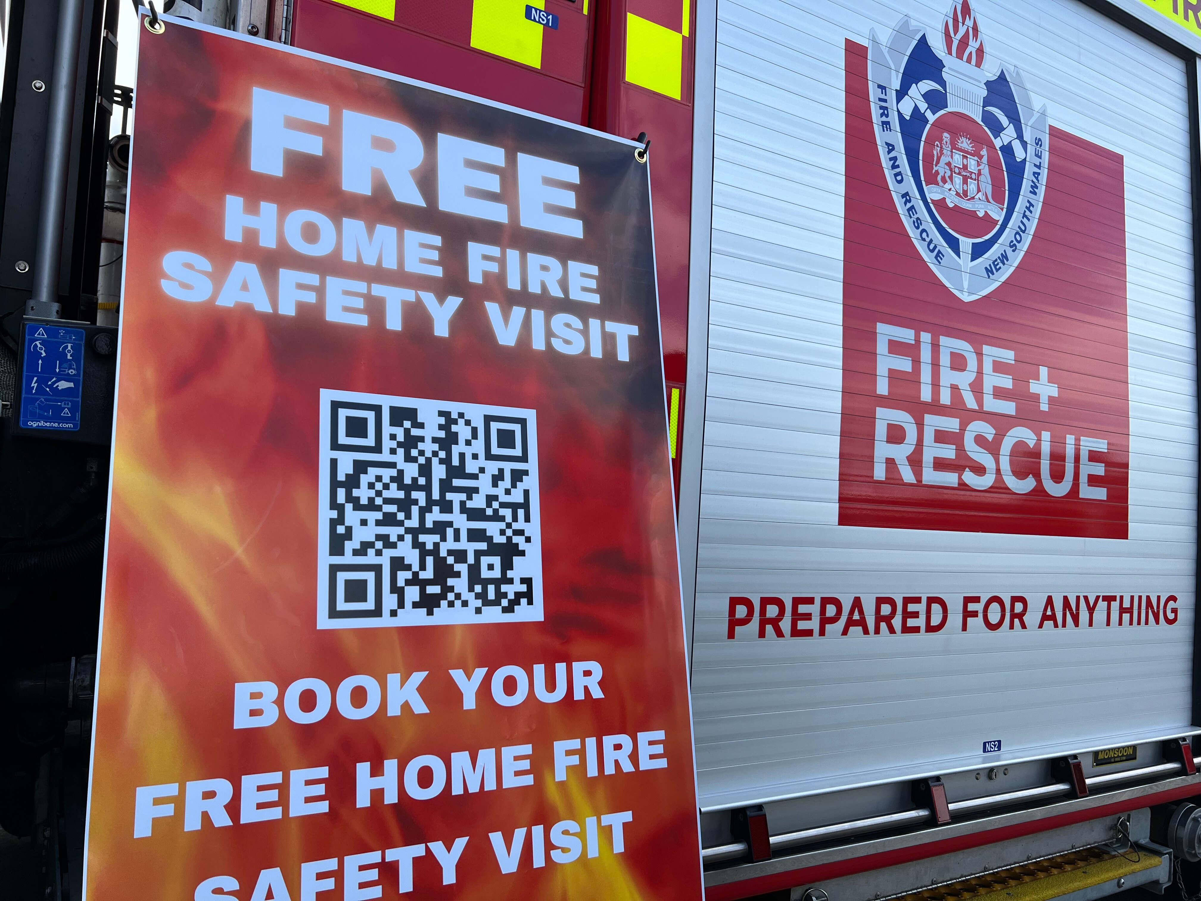 picture of a banner with a qr code and a FRNSW truck logo