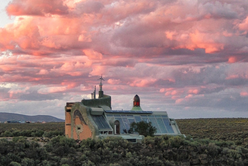 Built in 1996 the Nautilus Earthship in New Mexico was built on lava rock site with full-height tyre walls.