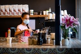 Melissa Djafar, manager at Darwin cafe Ruby G's Canteen and Bakery, making coffee. 