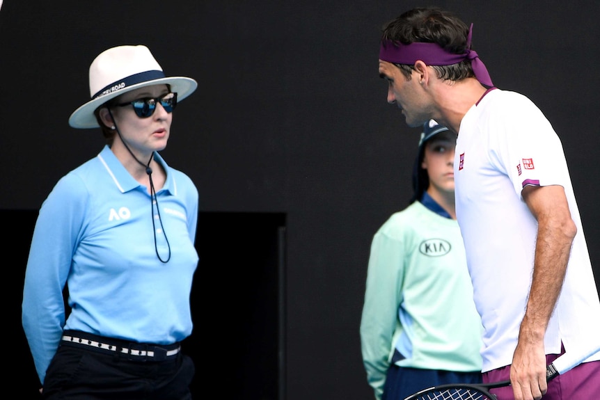 Roger Federer leans towards a lineswoman during his Australian Open quarter-final against Tennys Sandgren.