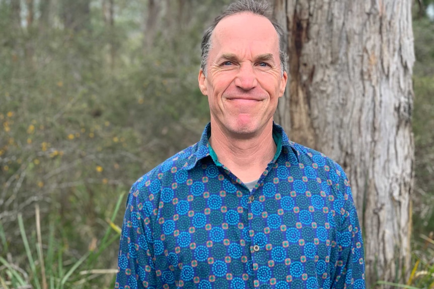 Rob Fairlie standing near a tree.