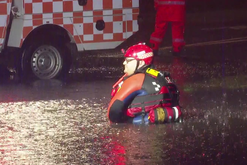 A man sitting and floodwater