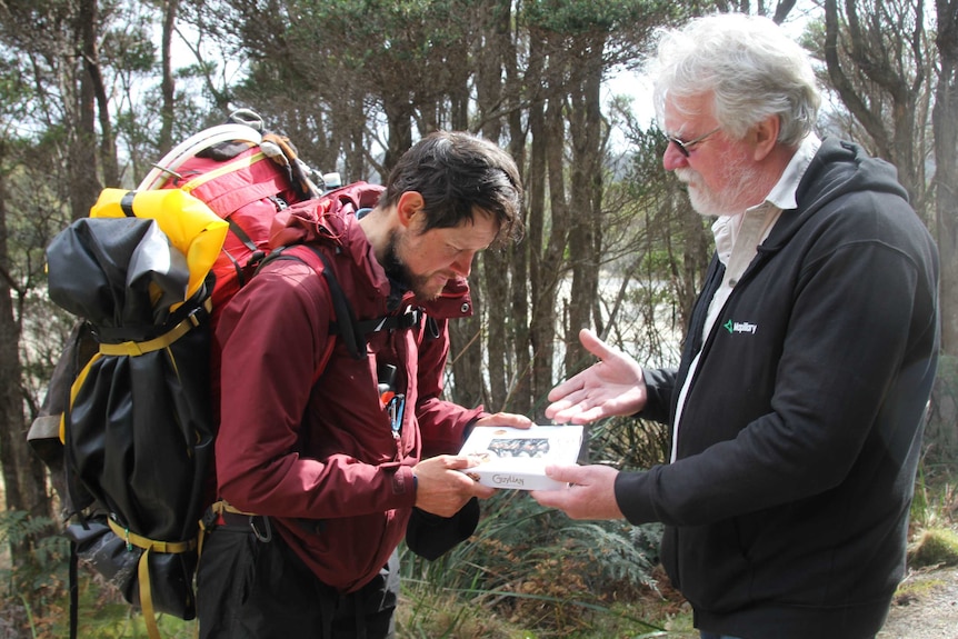 Former ranger Phil Wyatt presents Louis-Philippe Loncke with chocolates