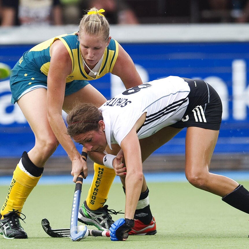 Solitary win ... Australia's Jodie Schulz (L) challenges Germany's Christina Schutze.