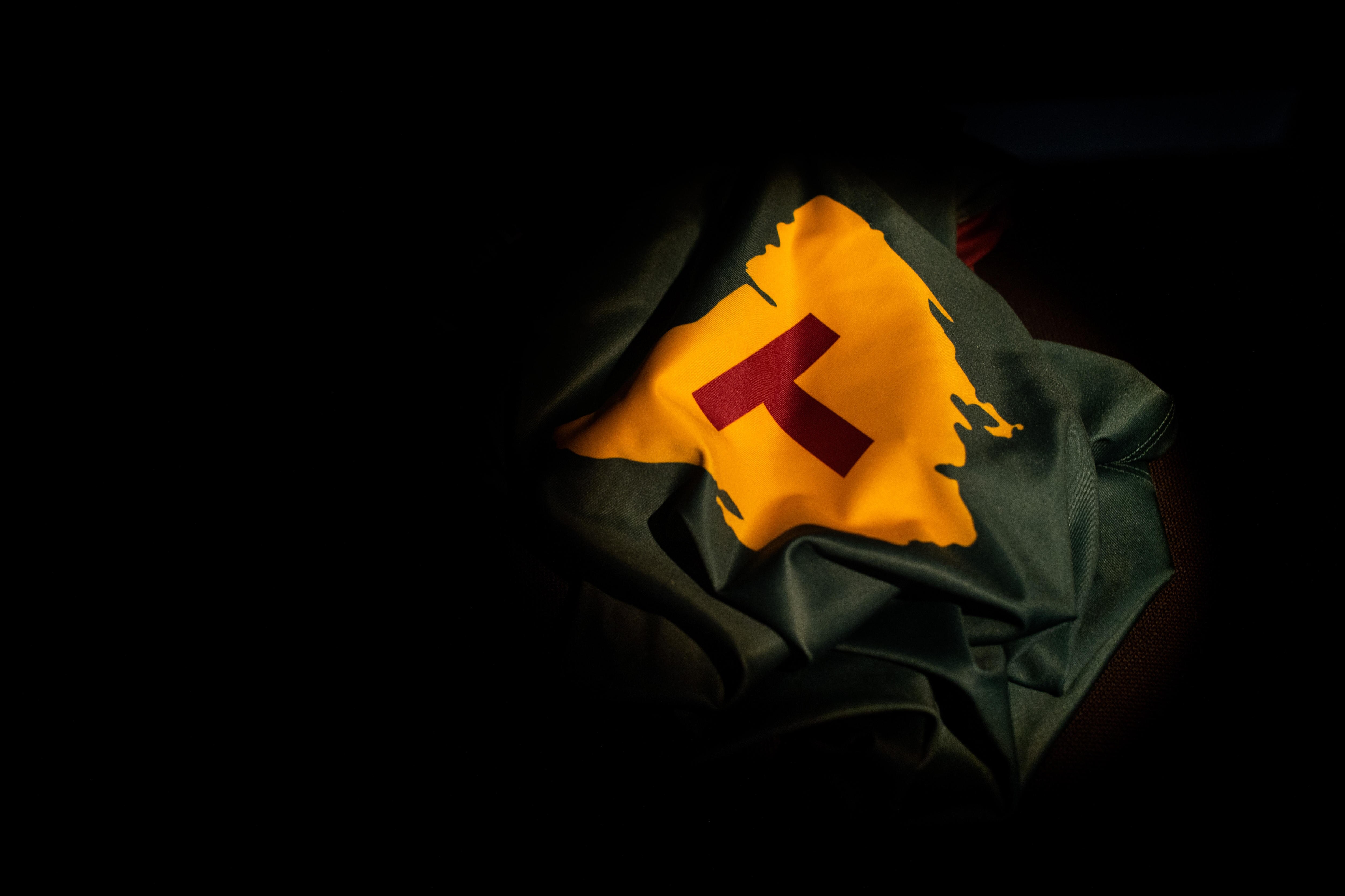 A map of Tasmania logo on a sports shirt.