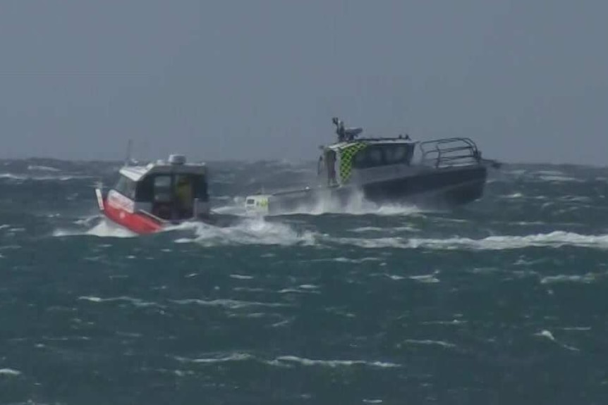 Two small boats on a choppy sea