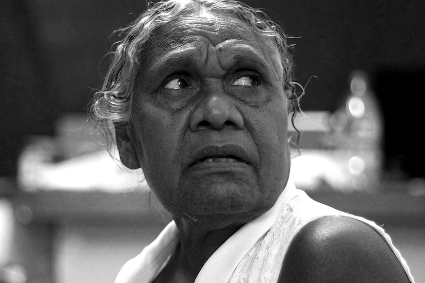 A black and white portrait of Yindjibarndi elder Ellery Sandy at the Roebourne art centre.