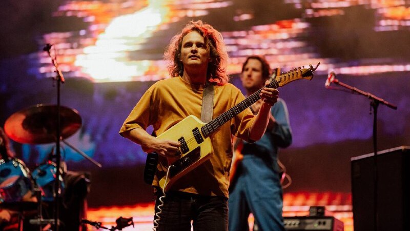 Stu Mackenzie of King Gizzard and the Lizard Wizard plays guitar onstage at Splendour In The Grass