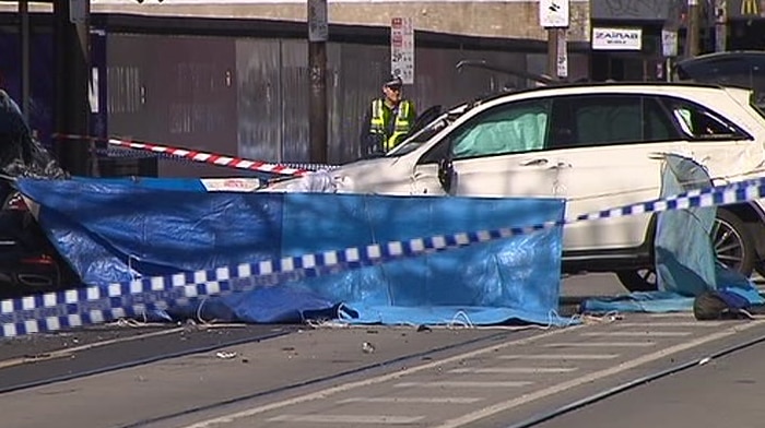 A white Mercedes is roped off by police tape after a fatal hit-and-run on Chapel Street.