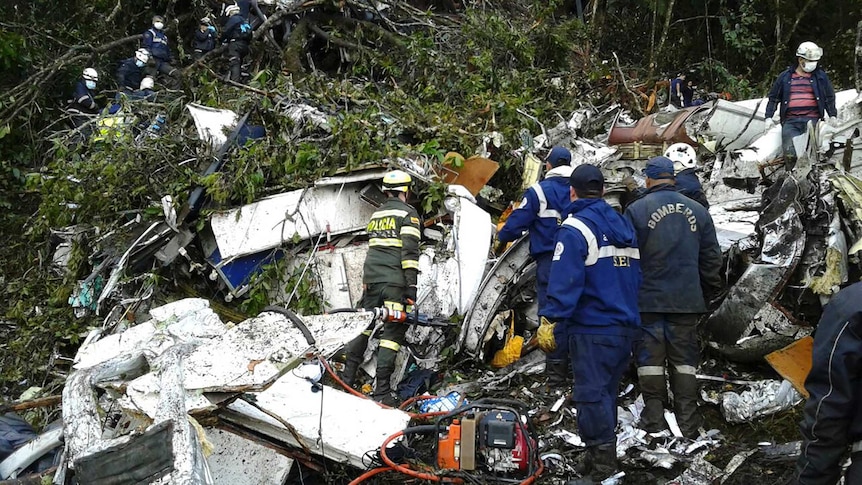 Rescue teams work near crashed chartered airplane outside Medellin, Colombia on November 29, 2016.