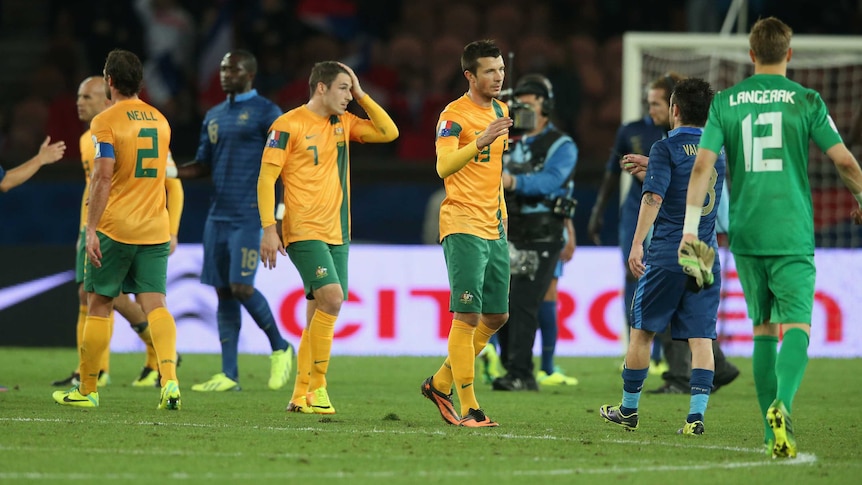 Australian players look dejected after a 6-0 loss to France at Parc Des Princes in Paris.