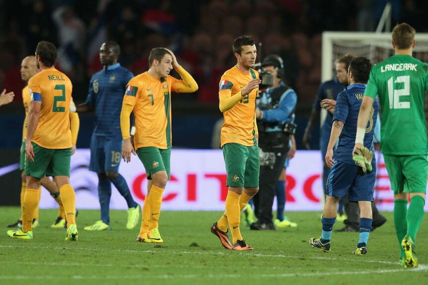 Australian players look dejected after a 6-0 loss to France at Parc Des Princes in Paris.