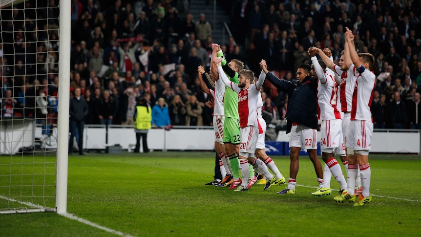 Ajax players celebrate their Champions League win over Barcelona in Amsterdam.