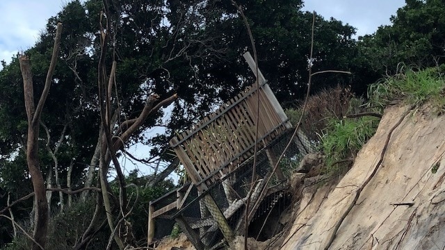 A viewing platform about to topple into the sea after severe erosion of sand dunes at Byron Bay's Clarkes Beach.