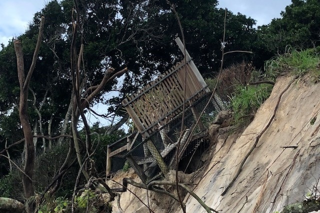 A viewing platform about to topple into the sea after severe erosion of sand dunes at Byron Bay's Clarkes Beach.