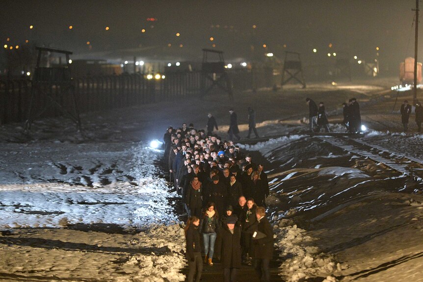 Guest walk in a procession at Auschwitz anniversary