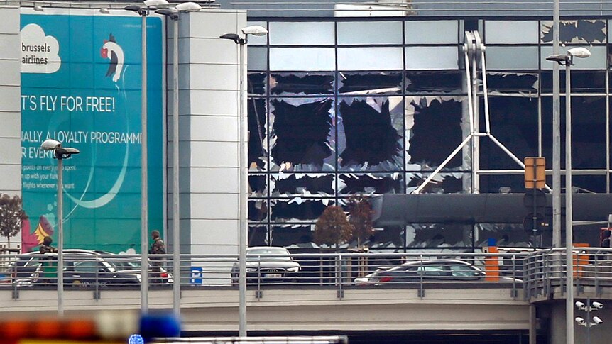 Broken windows seen at the scene of explosions at Zaventem airport