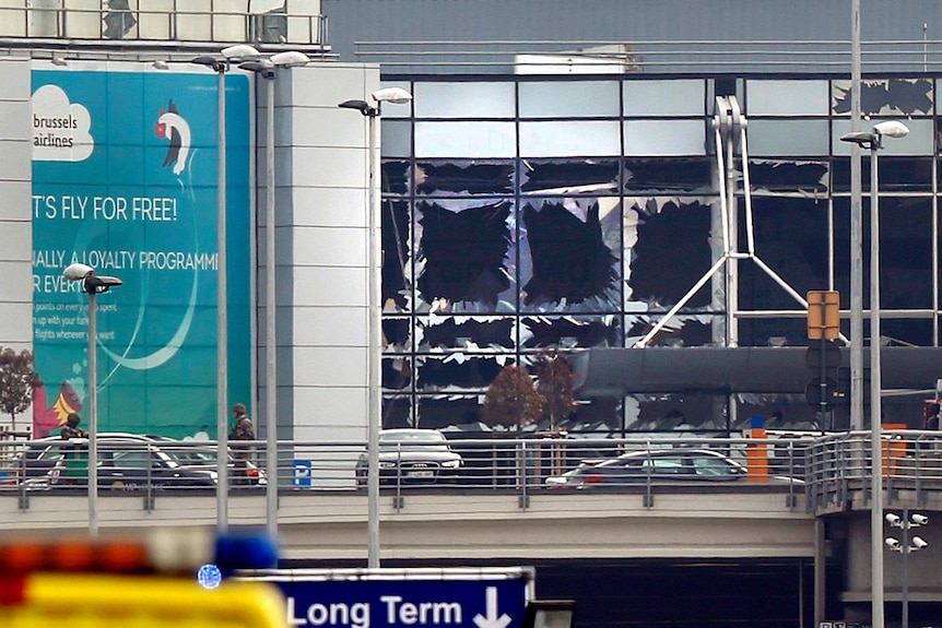 Broken windows seen at the scene of explosions at Zaventem airport