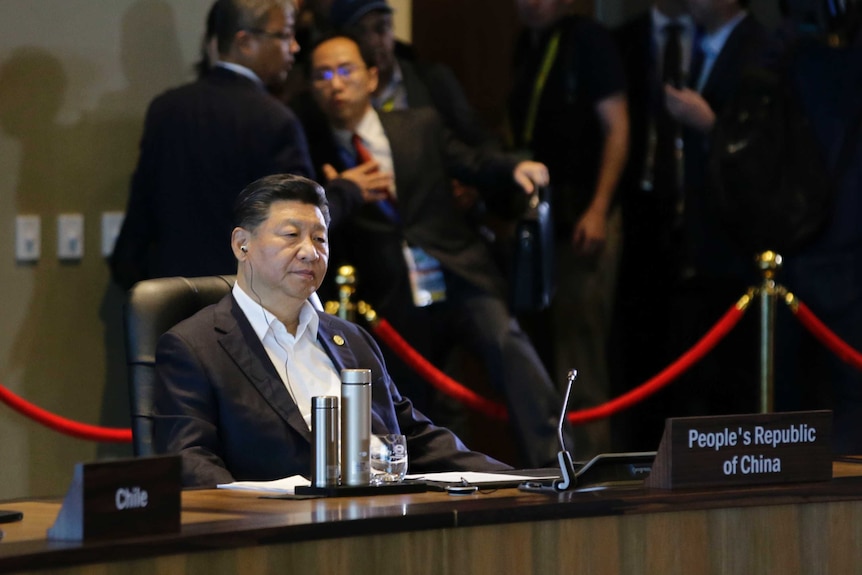 Chinese President Xi Jinping listens during the IMF informal dialogue at APEC in Port Moresby.