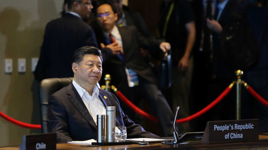 Chinese President Xi Jinping listens during the IMF informal dialogue at APEC in Port Moresby.