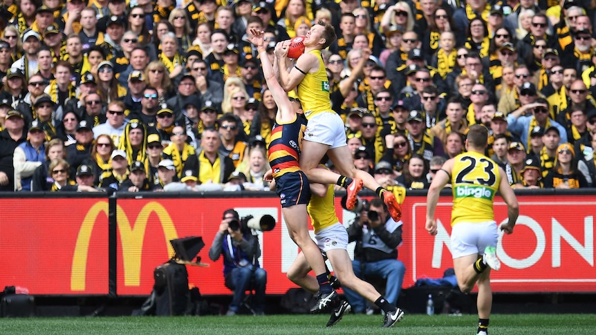 Richmond's Jack Riewoldt (2L) marks in the first quarter of the 2017 grand final against Adelaide.