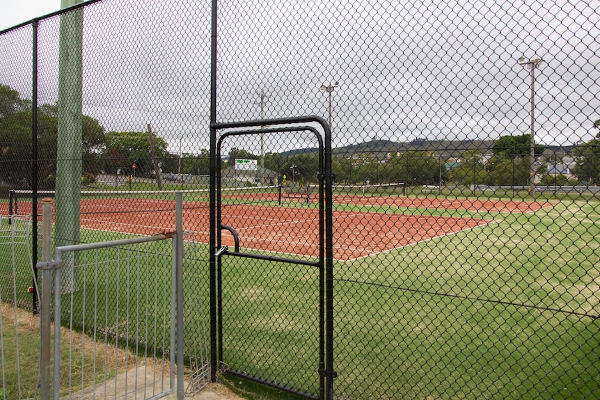 One year on and Dungog's tennis courts are fully repaired, complete with new fences.