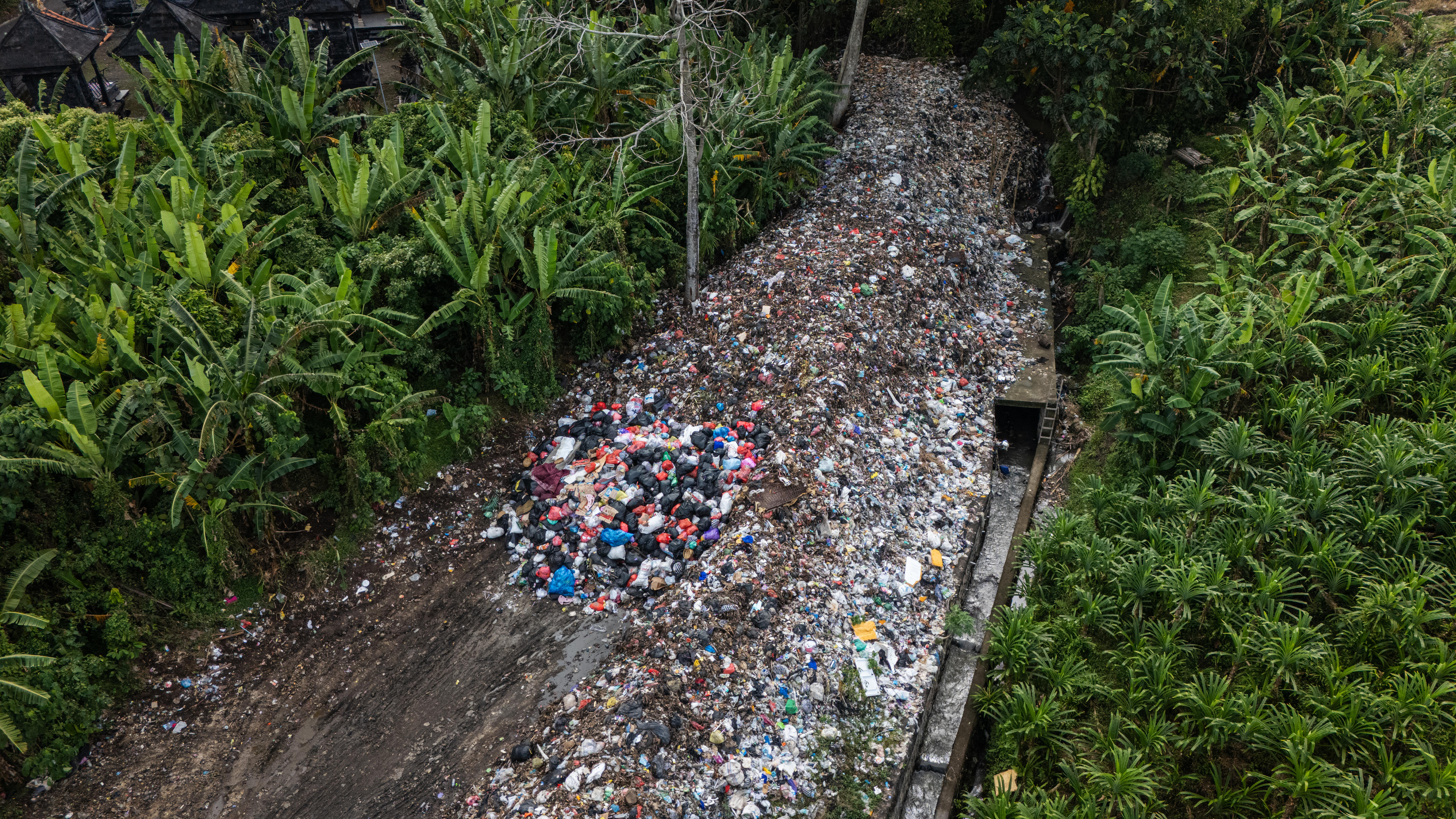 A view of a pile of trash stretchng through land in Buduk.