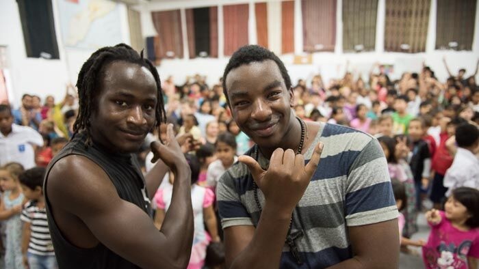 West African rappers perform to school children in East Timor to mark anniversary of Balibo five deaths