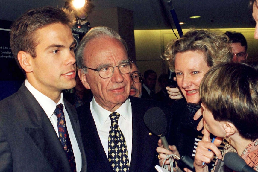 Lachlan and Rupert Murdoch speak at a press conference 
