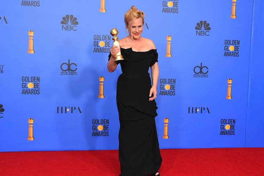 Patricia Arquette poses in the press room with the award for best performance by an actress in a limited series