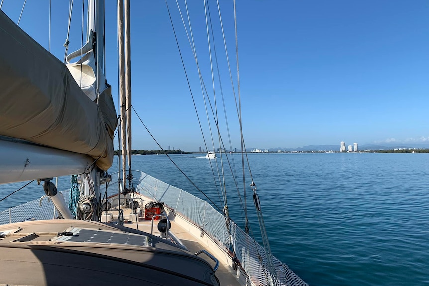 A photo of the stern of a boat, with the blue ocean in the background.