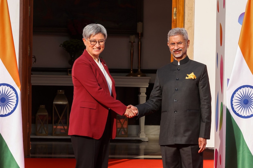 Penny Wong shakes hands with  S Jaishankar