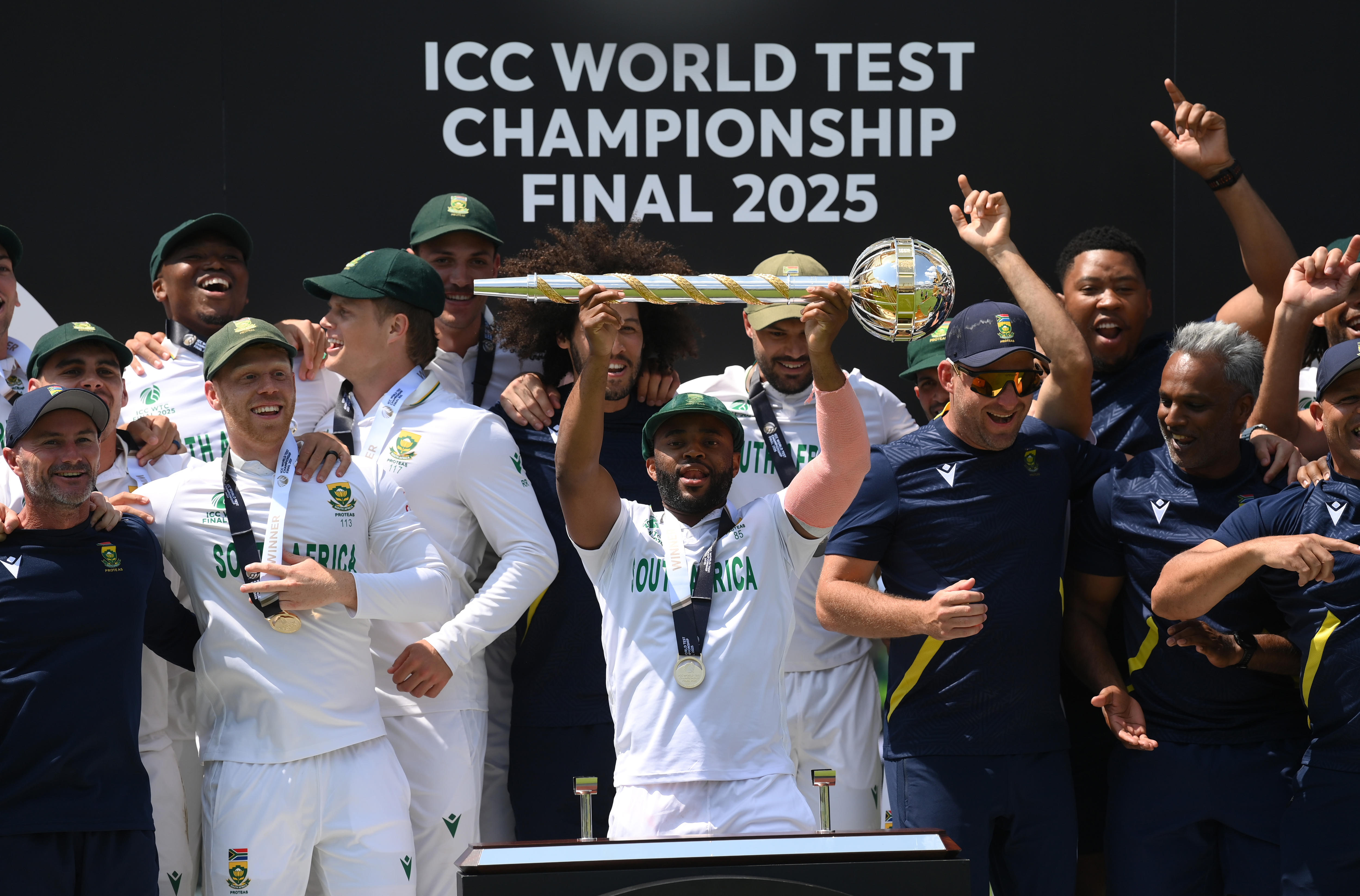 Temba Bavuma holds a trophy above his head
