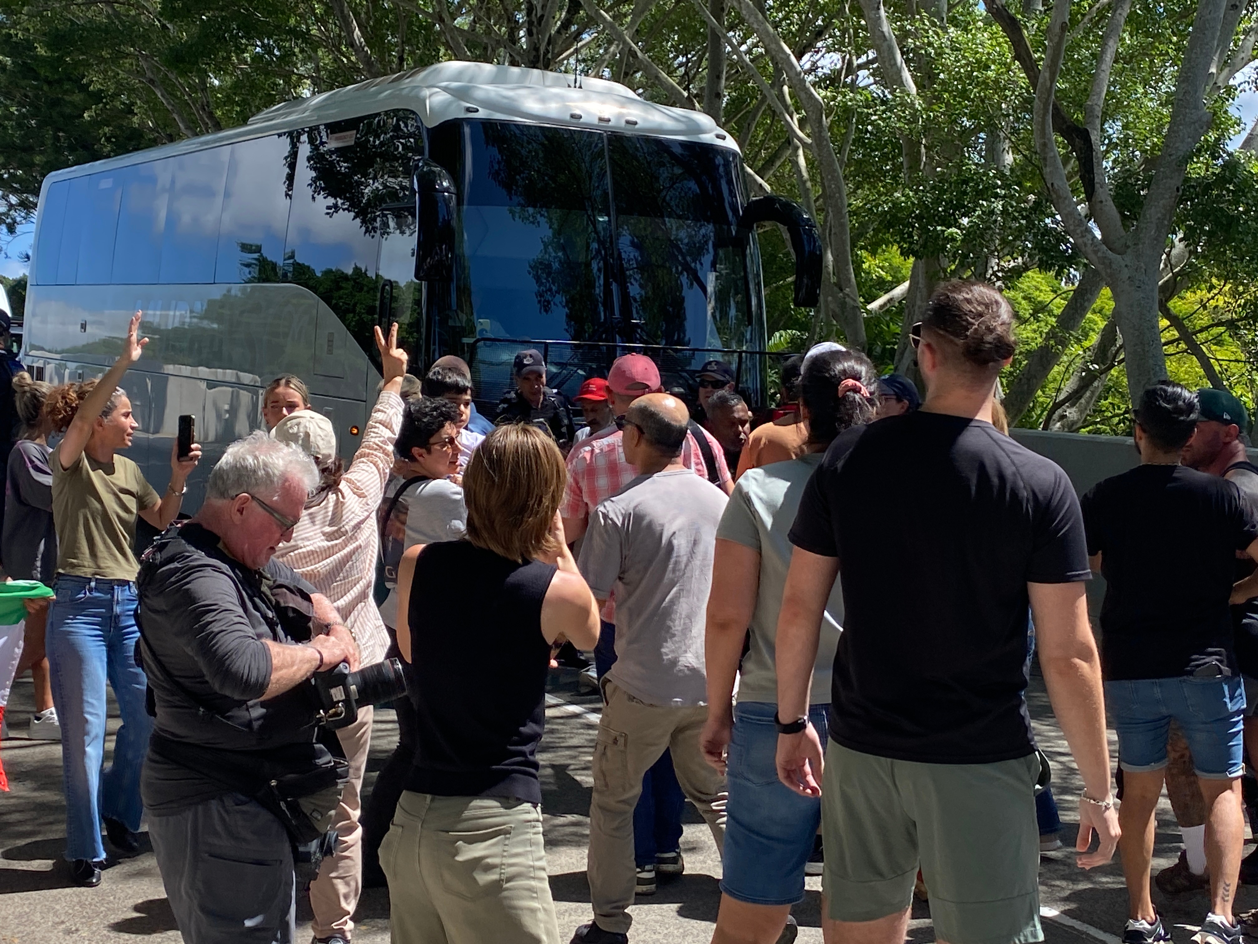 Live: Police escort Iranian women's football team to airport amid protests
