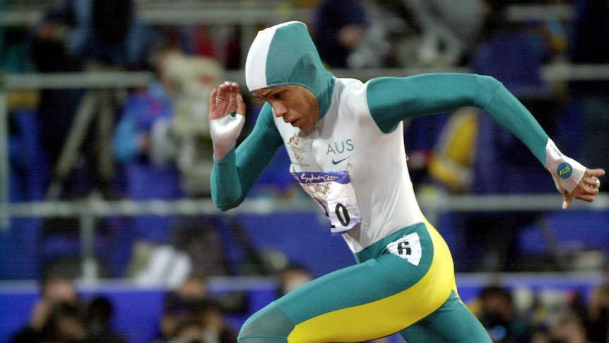 Australian Indigenous female runner Cathy Freeman, in stride, during her gold medal run at the Sydney Olympics