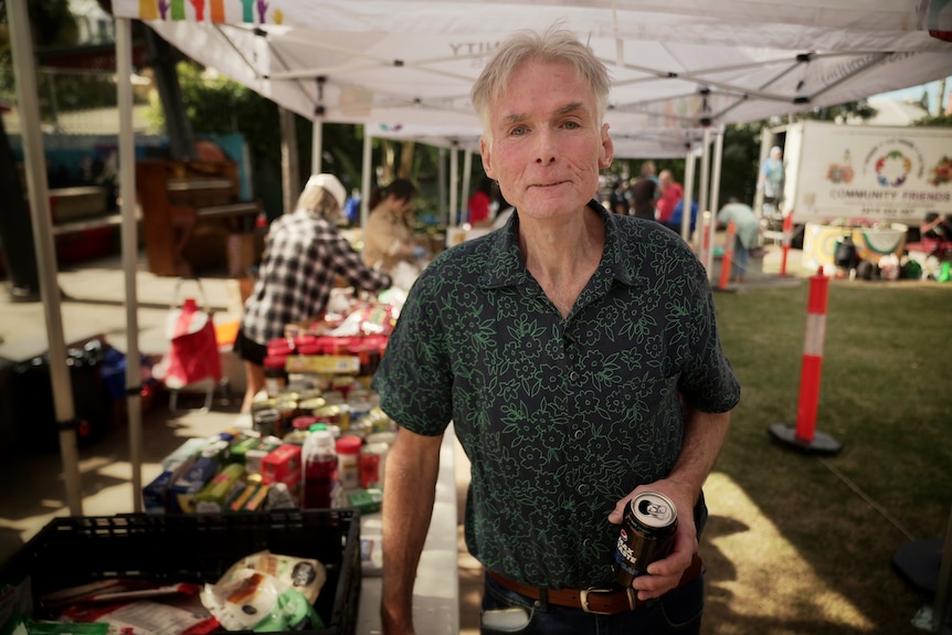 Mark McDonnell holds a can of soft drink