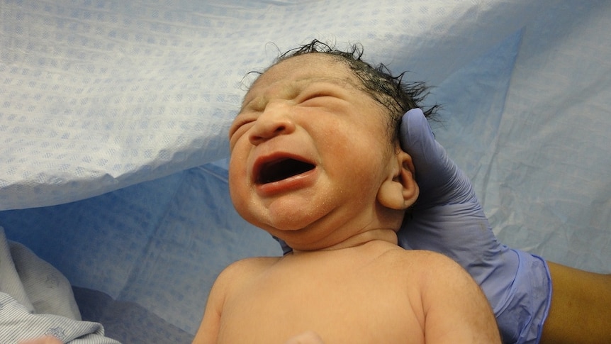 a newborn baby takes his first breaths