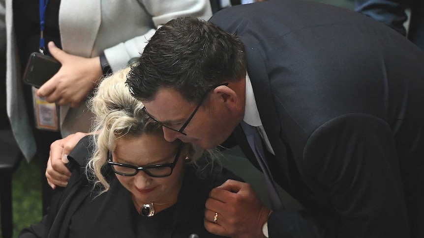 Victorian Premier Daniel Andrews embraces Health Minister Jill Hennessy in Victoria's Parliament.