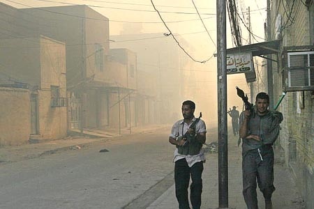 Militiamen patrol Najaf.