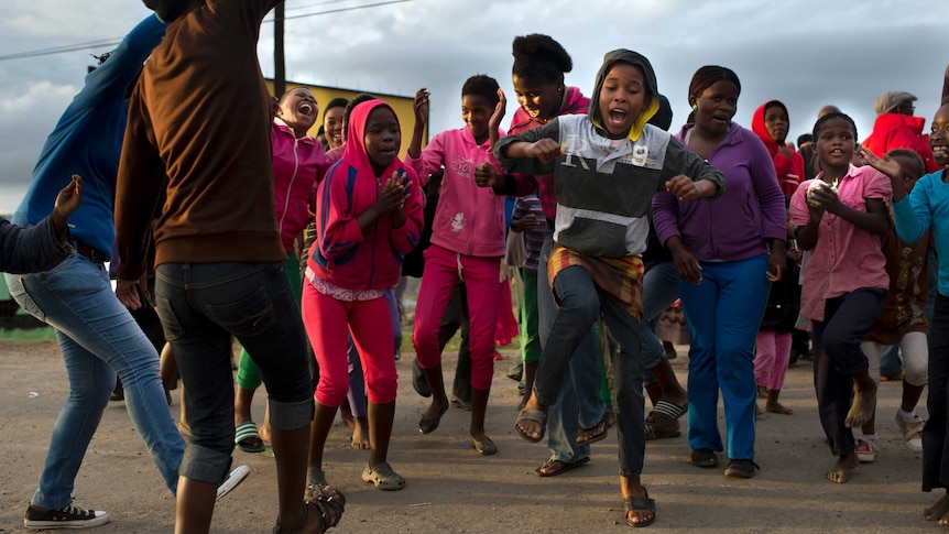 Young people dance near Nelson Mandela's house in Qunu
