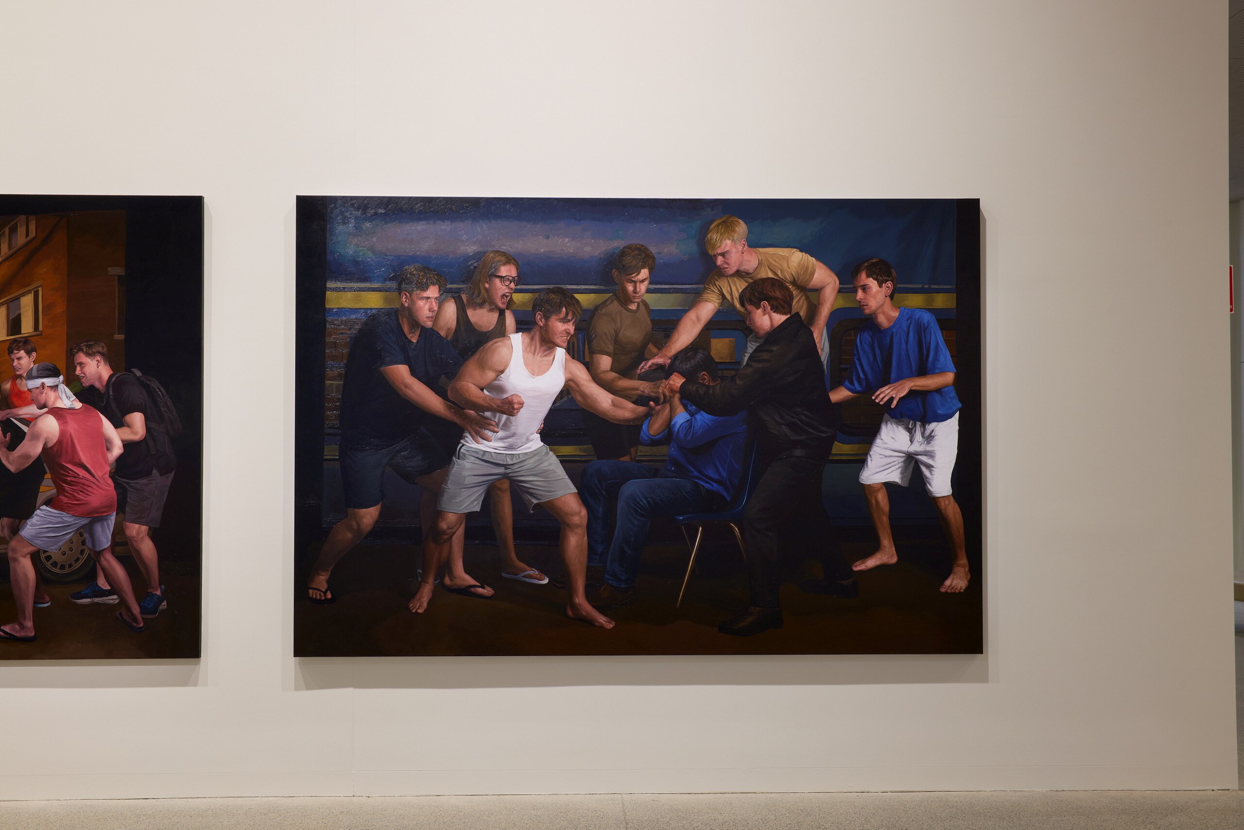 A painting of an angry mob of young white men surrounding a seated dark-skinned person.